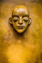 Gold statue face