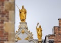 Gold statue on top of the arch of the Gerechtshof (courthouse) leading into Burg Royalty Free Stock Photo