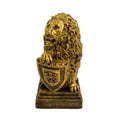 Gold statuette of a lion with shield isolated on a white background