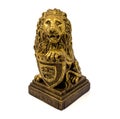 Gold statuette of a lion with shield isolated on a white background Royalty Free Stock Photo