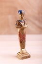 A gold statuette of a pharaoh
