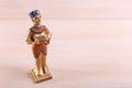 A gold statuette of a pharaoh