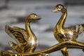 Gold statuette of swans Royalty Free Stock Photo