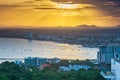 Gold sunlight shinning down to the city along side Pattaya beach