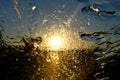 Gold Sunset abstract rain on the car front windshield Royalty Free Stock Photo