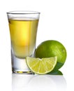 Gold tequila shot with lime isolated on white