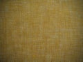 Gold texture linen fabric. Textile yellow background. Royalty Free Stock Photo