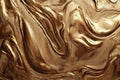 A gold textured surface with a smooth, reflective finish, showcasing swirling, marbled patterns Royalty Free Stock Photo