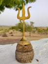 Gold Trident of lord shiva,with old wood stand Royalty Free Stock Photo