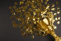 Gold trophy cup and confetti on black background. Space for text Royalty Free Stock Photo