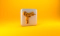 Gold UZI submachine gun icon isolated on yellow background. Automatic weapon. Silver square button. 3D render