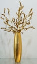 Gold vase with gold flower