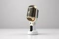 Gold vintage microphone 3D render style over white background. Royalty Free Stock Photo