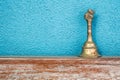 Gold vintage retro bell on wooden table Royalty Free Stock Photo