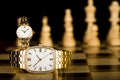 Gold Watches on chess board Royalty Free Stock Photo