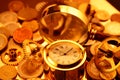 Gold watches, coins, gears and magnifying glass