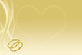 Gold wedding background with rings and heart Royalty Free Stock Photo