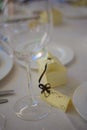 Gold wedding party favors on plate at reception Royalty Free Stock Photo