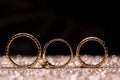 Gold wedding rings on an abstract background with copy space Royalty Free Stock Photo