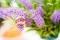 gold wedding rings on lavender flowers nature blur background.