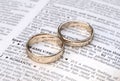 Gold wedding rings on a page showing love Royalty Free Stock Photo