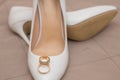 Gold wedding rings are on shoes Royalty Free Stock Photo