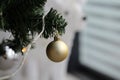 Gold, White and Silver Christmas Ornaments in Christmas Tree Branch Royalty Free Stock Photo