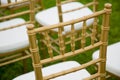 Gold and whiteChairs for wedding ceremony