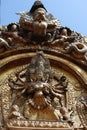 Gold-winged bird and big black sky statue along Nepal temple door Royalty Free Stock Photo