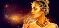 Gold woman skin. Beauty fashion model girl with golden makeup Royalty Free Stock Photo