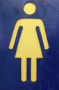 Gold women sign on blue background