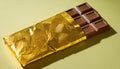 A gold wrapper with a chocolate bar inside Royalty Free Stock Photo