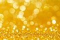 Gold,yellow abstract light background, Gold  bokeh shining lights, sparkling glittering Christmas lights.Season greeting backgroun Royalty Free Stock Photo