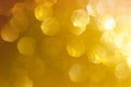 Gold, yellow abstract light background, Pink Gold bokeh shining lights, sparkling glittering Christmas lights.Season greeting bac Royalty Free Stock Photo