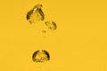 Gold yellow oil bubble background. Liquid drops in macro Royalty Free Stock Photo