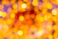 Gold yellow and red abstract background with bokeh defocused blurred lights Royalty Free Stock Photo