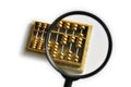 Golden abacus magnified Royalty Free Stock Photo
