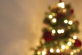 Golden abstract blinking blurred Christmas tree lights bokeh on gold warm background, festive holiday