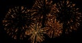 Golden abstract blinking sparkle celebration fireworks lights on black background, festive happy new year Royalty Free Stock Photo