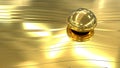 Golden abstraction with a transparent ball. Close-up of a golden drop of liquid gold on a golden texture. Royalty Free Stock Photo