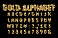 Golden alphabet on a dark background