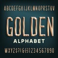 Golden alphabet font. Beveled condensed  letters, numbers and symbols with shadow. Royalty Free Stock Photo