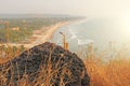 The golden alto saxophone stands on the background of the beach Royalty Free Stock Photo