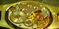 A golden analog watch mechanism