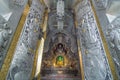 Golden ancient buddha in The silver ubosot (ordination hall) of