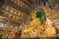 Golden ancient buddha in The silver ubosot (ordination hall) of