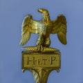 Golden ancient Roman sculpture of an eagle with the inscription H. et. P. lat: Heres ex testament posuit Royalty Free Stock Photo