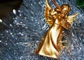 Golden Angel playing a pipe in a Christmas Royalty Free Stock Photo