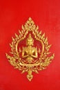 Golden god (Deva) on the red wall Thai art Royalty Free Stock Photo