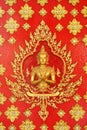 Golden god (Deva) on the red wall Thai art Royalty Free Stock Photo